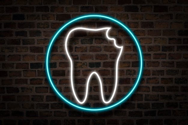 Damaged Tooth, Neon sign on the background of the fire wall. The concept of dental clinic, first aid.