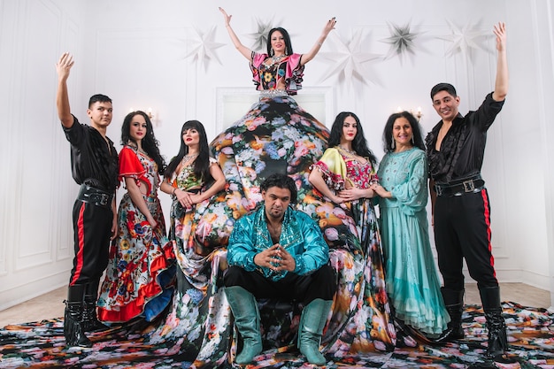 Dance group in Gypsy costumes posing on stage. folk dance