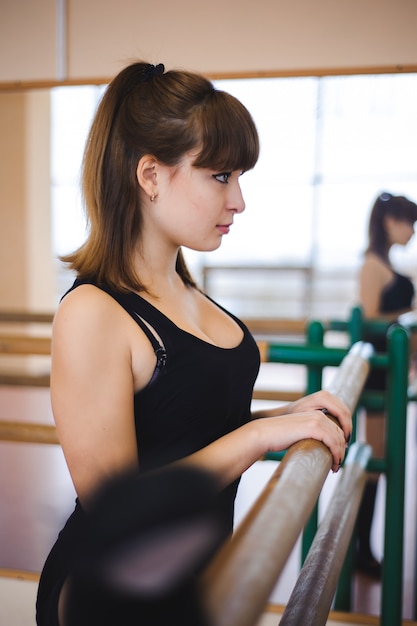 Dancer is doing exercises in ballet class