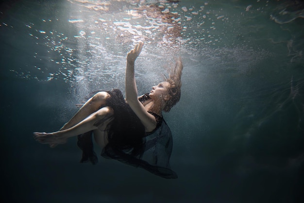 Dancer underwater in a state of peaceful levitation