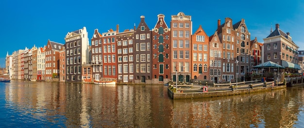 The dancing houses at Amsterdam canal Damrak Holland Netherlands