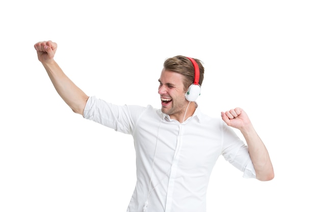 Dancing music. Man listening favourite song in headphones and dancing. Man happy face enjoy listening music radio isolated white background. Guy with earphones dancing while listening music.