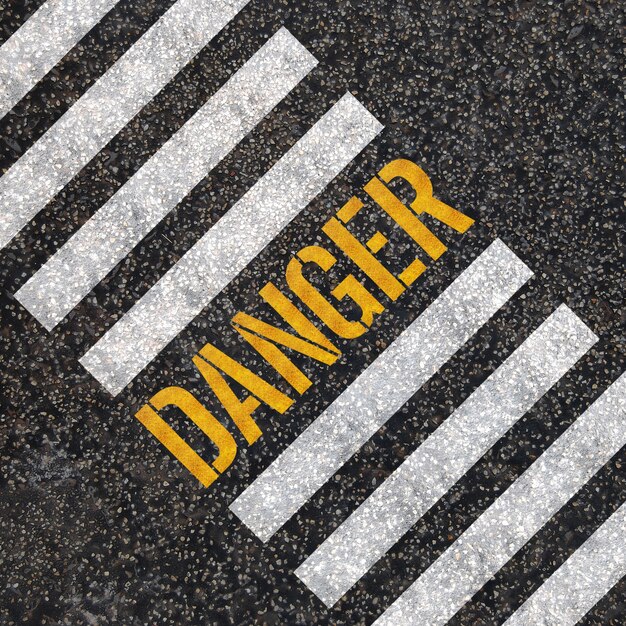 Danger concept : paint on asphalt road