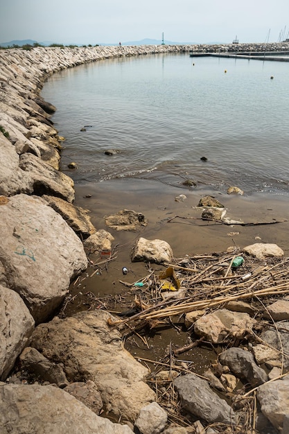 Danger to the environment pollution of the world's oceans with plastic garbage Dirty beach in the waste World Oceans Day save water from pollution