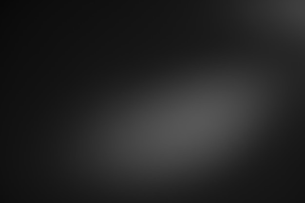 Dark black and gray blurred gradient background has a little abstract light