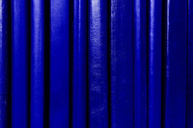 Dark blue books spines background. Education concept.