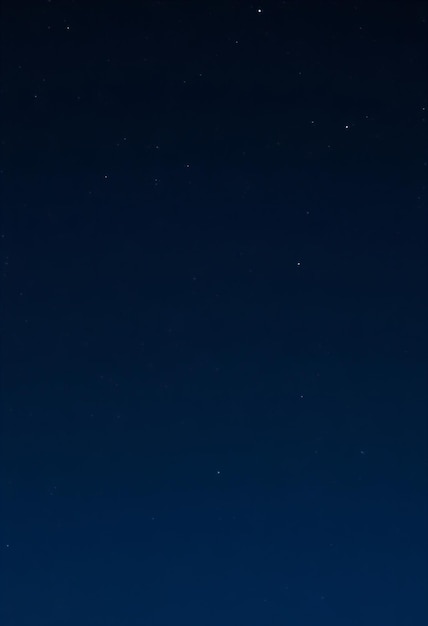 Photo a dark blue sky with stars and a star in the sky