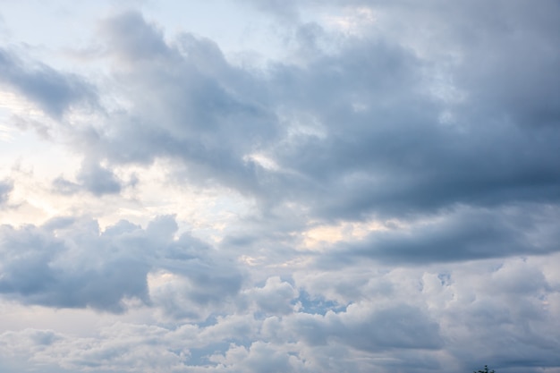 Dark blue sunset sky with rain clouds