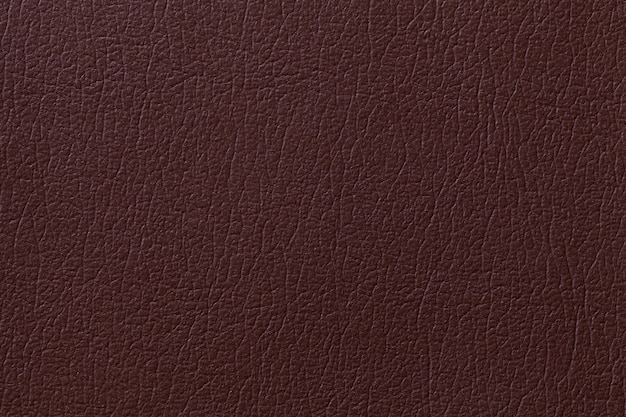 Dark brown leather texture background, closeup