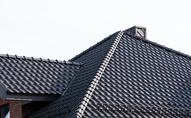 Dark brown metal roof tiles The roof of corrugated sheet Roof of a new home