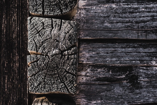 Dark brown weathered textured wooden logs