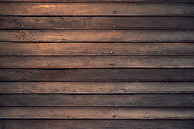 Dark brown wood plank of old tradition house for wood texture background