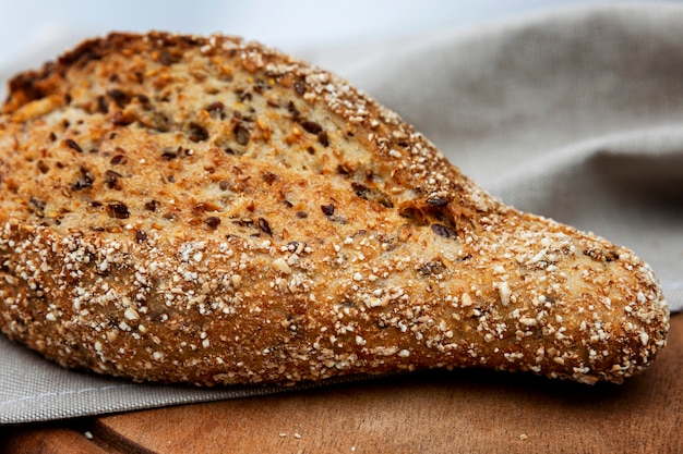 Dark cereal bread on a wooden board