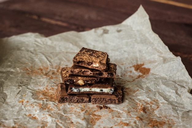 Dark chocolate bark with mixed fillingson wax paper