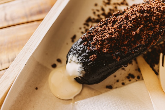 Dark chocolate bread with white creamy custard in a cafe