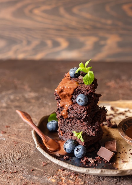 Dark chocolate brownie with blueberry mint chocolate sauce and pieces of bitter chocolate