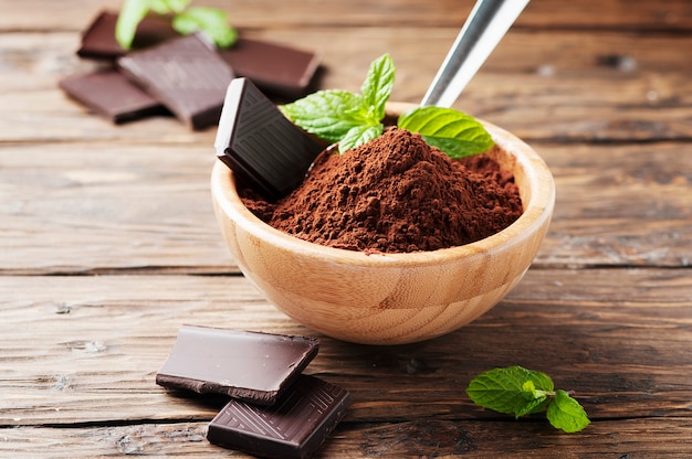 Dark chocolate and cacao on the wooden table