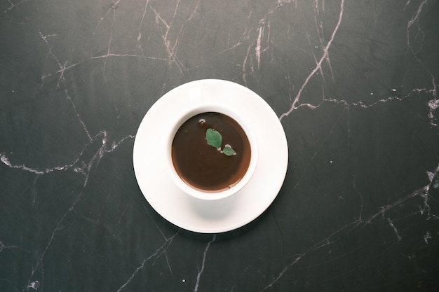 Dark chocolate cream in a coffee cup on table