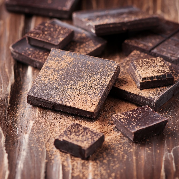 Dark chocolate tablets on table