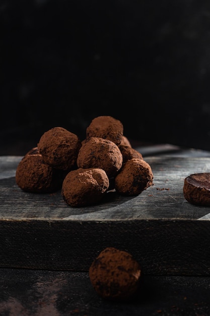 Dark chocolate truffle on dark background