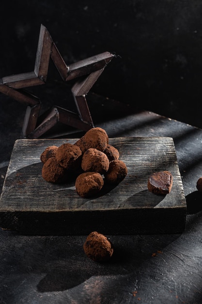 Dark chocolate truffle on dark background