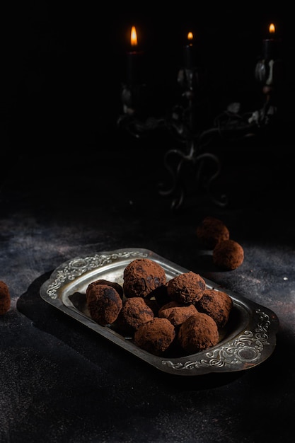 Dark chocolate truffle on dark background

