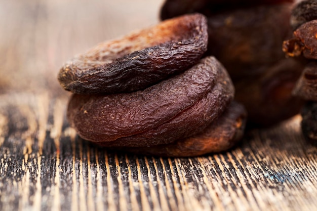 Dark dried apricots of large size