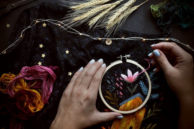 Dark flat lay with embroidery craft handmade hobby