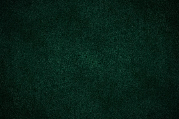 Dark green color solid textured cement plaster wall surface for background