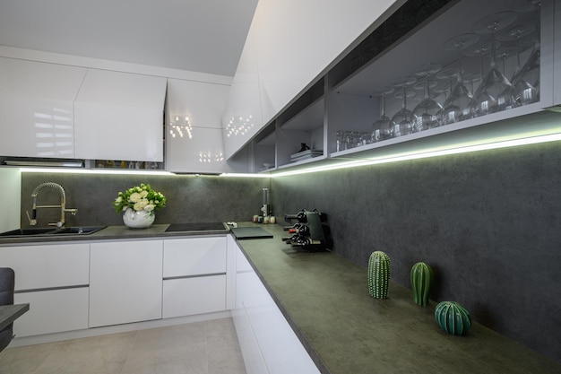 Dark grey counter counter top at white trendy kitchen