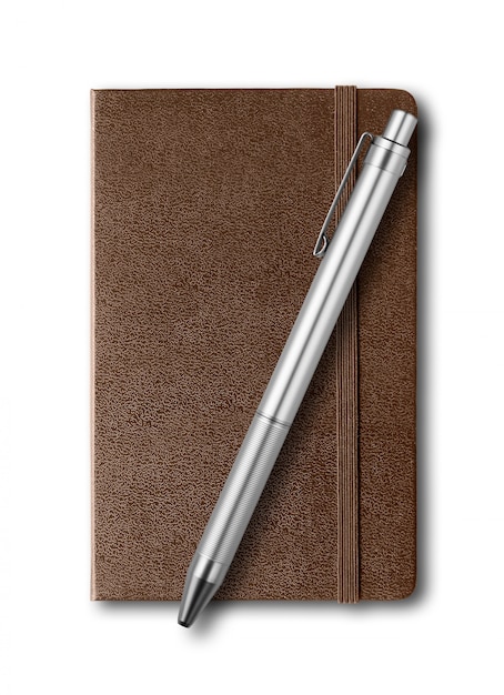 Dark Leather closed notebook and pen isolated