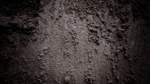 Dark old cement texture background the walls are full of stains and scratches