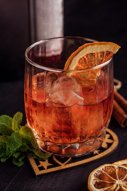 Dark orange drink in glass close up