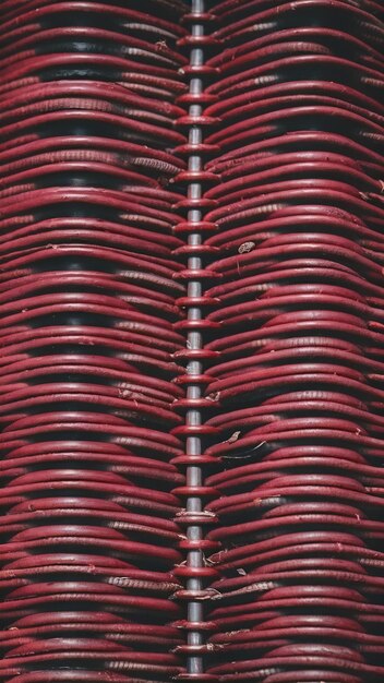 Dark red background from a textile material with wicker pattern closeup