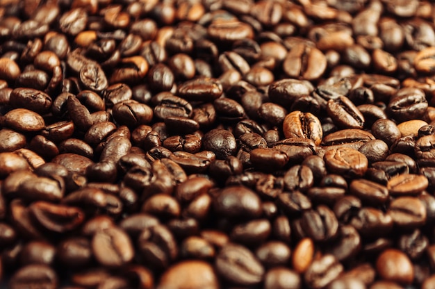 Dark roasted coffee beans background