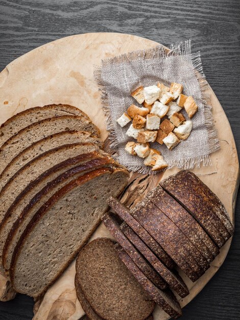 Dark rue bread on a wooden background