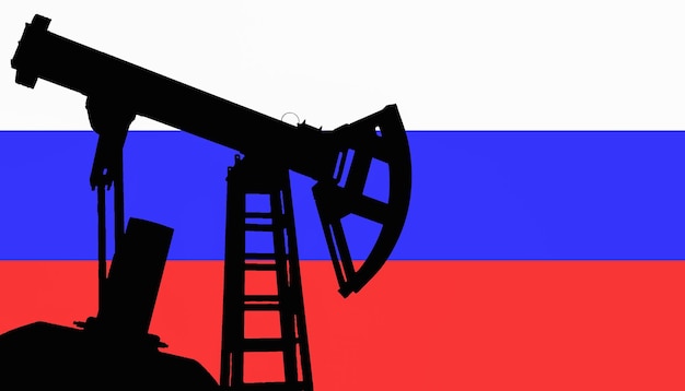 Dark silhouette of oil pump the background tha flag of Russia