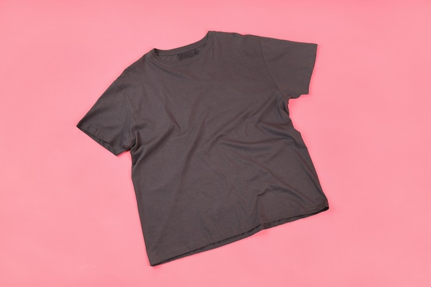 Dark t-shirt with space for print on pink background