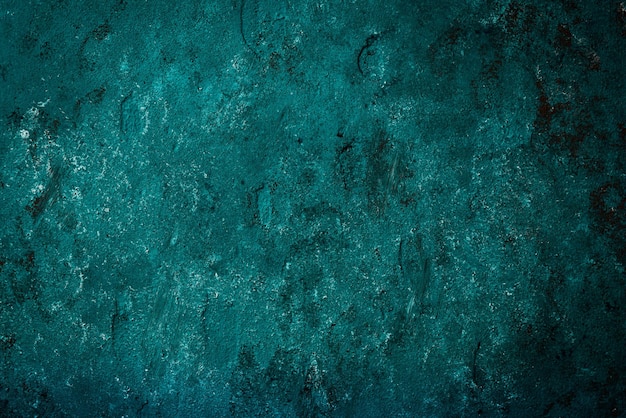 Photo dark turquoise stone texture old background with oxidized metal elements free space for text