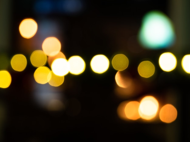 Dark urban background with defocused bulbs