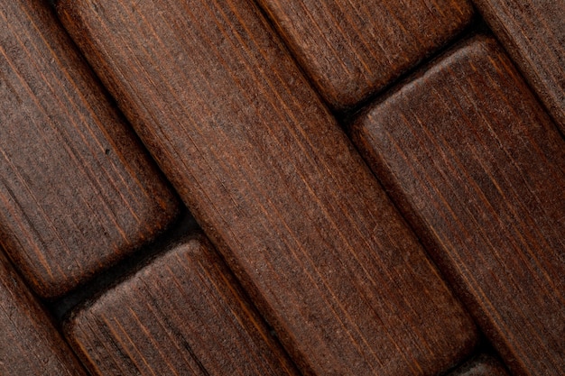 Dark wood texture in the shape of small rectangles (collection of natural and vegetal fibers)