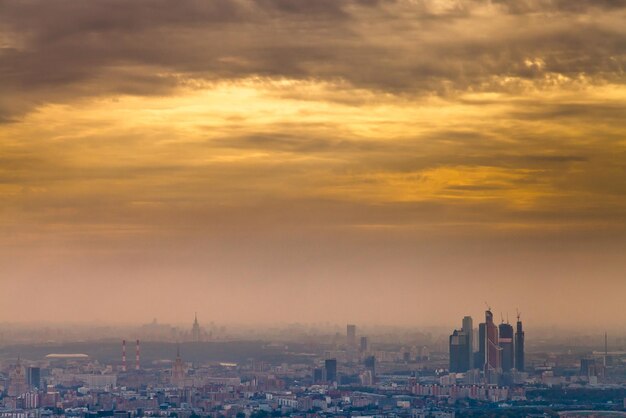 Dark yellow autumn sunset under Moscow city