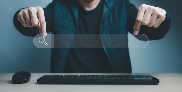 Photo data search technology search engine optimization mans hands showing a search bar and a computer keyboard and mouse to searching for information using search console with your website