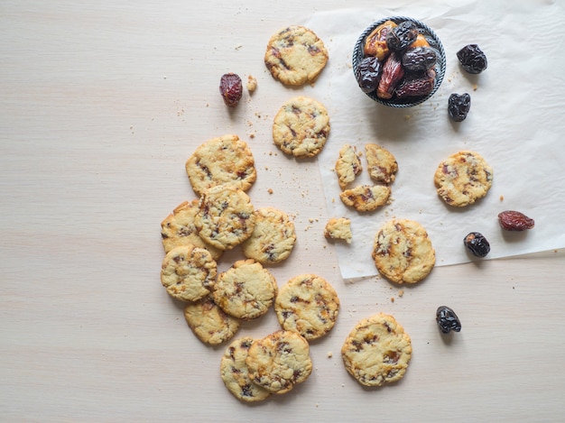 Date cookies it is laid out on a light wooden surface. Top view, copy space.