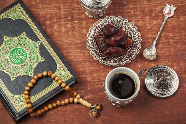 Date fruits, Koran and wooden rosary beads for Muslims Ramadan