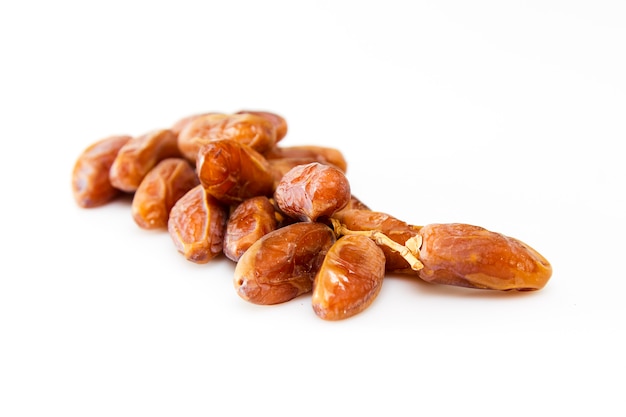 Date fruits over white background