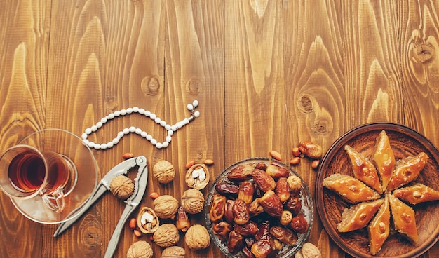 Dates, rosaries and baklava. Ramadan. Selective focus.