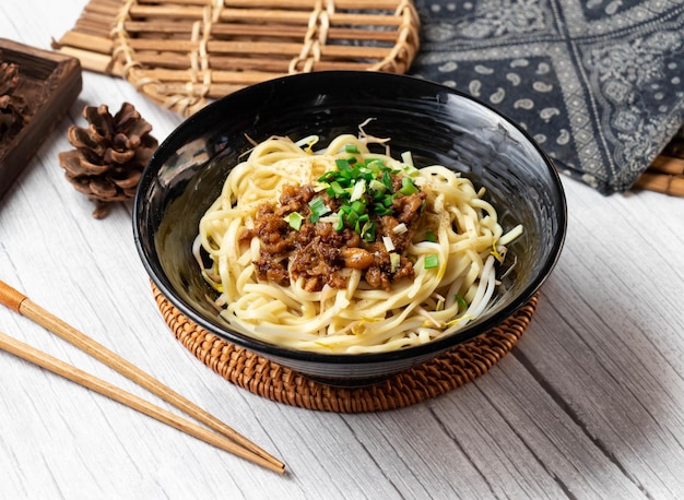 Datong Noodle Soup in a dish isolated on wood table side view taiwan food