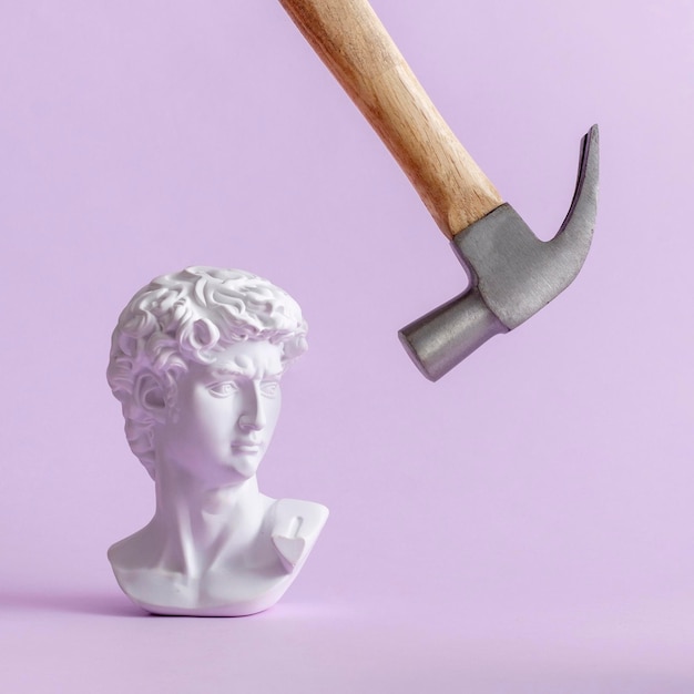 David historical plaster statue of Michelangelo in vaporwave style and a hammer makes a blow