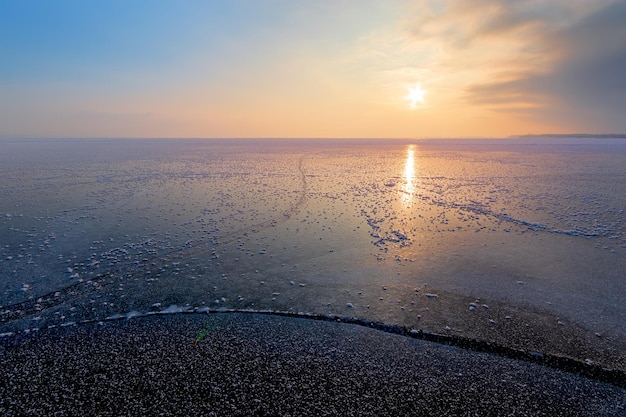 Dawn on an icy lake, dawn winter morning winter landscape